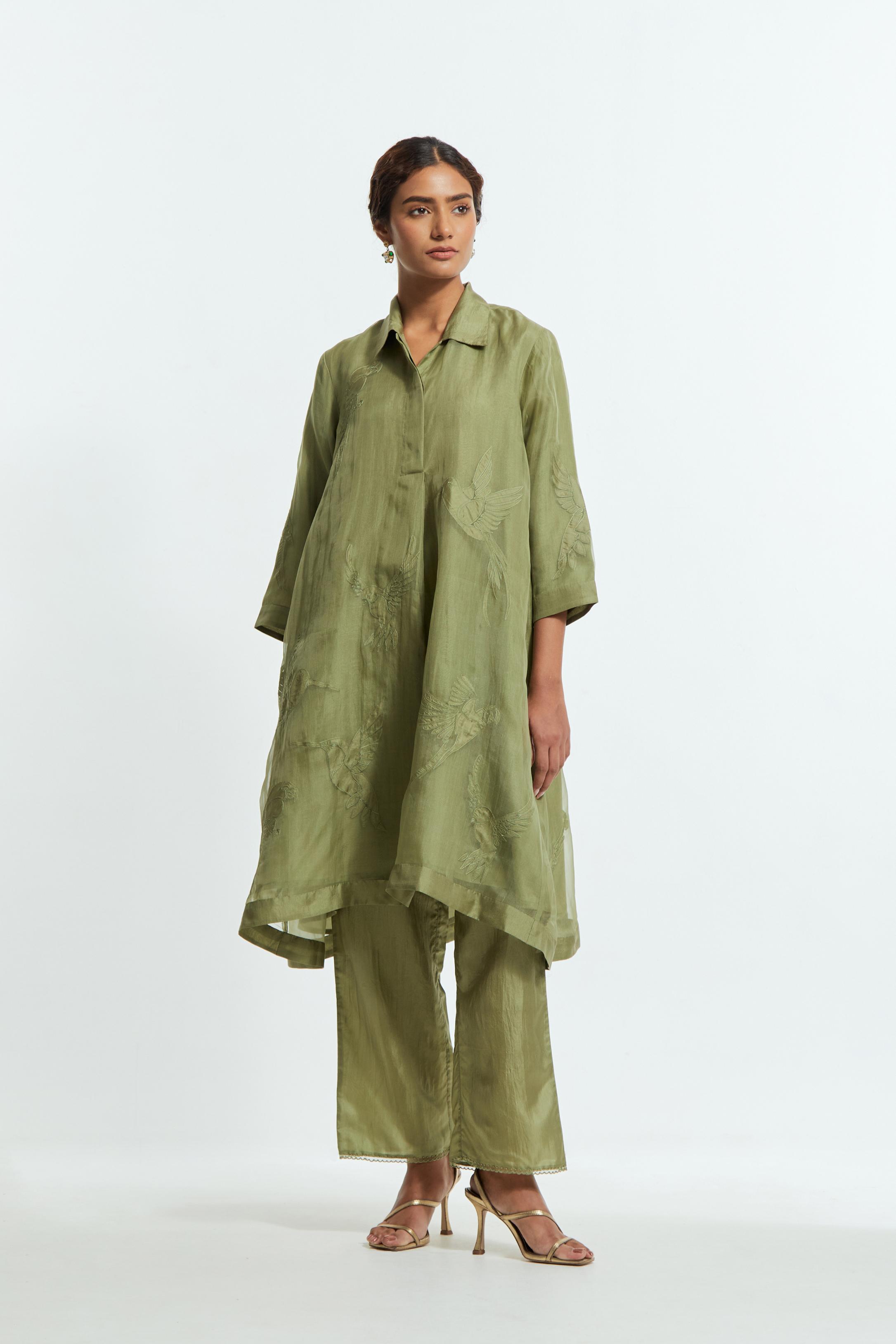 Green silk organza A-line short kurta featuring appliqué bird motifs gracefully placed across the front, back and sleeves. Paired with Green silk straight pants detailed with scalloped organza edging at the hem, delicately highlighted with tonal beadwork.