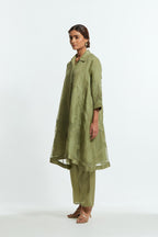 Green silk organza A-line short kurta featuring appliqué bird motifs gracefully placed across the front, back and sleeves. Paired with Green silk straight pants detailed with scalloped organza edging at the hem, delicately highlighted with tonal beadwork.