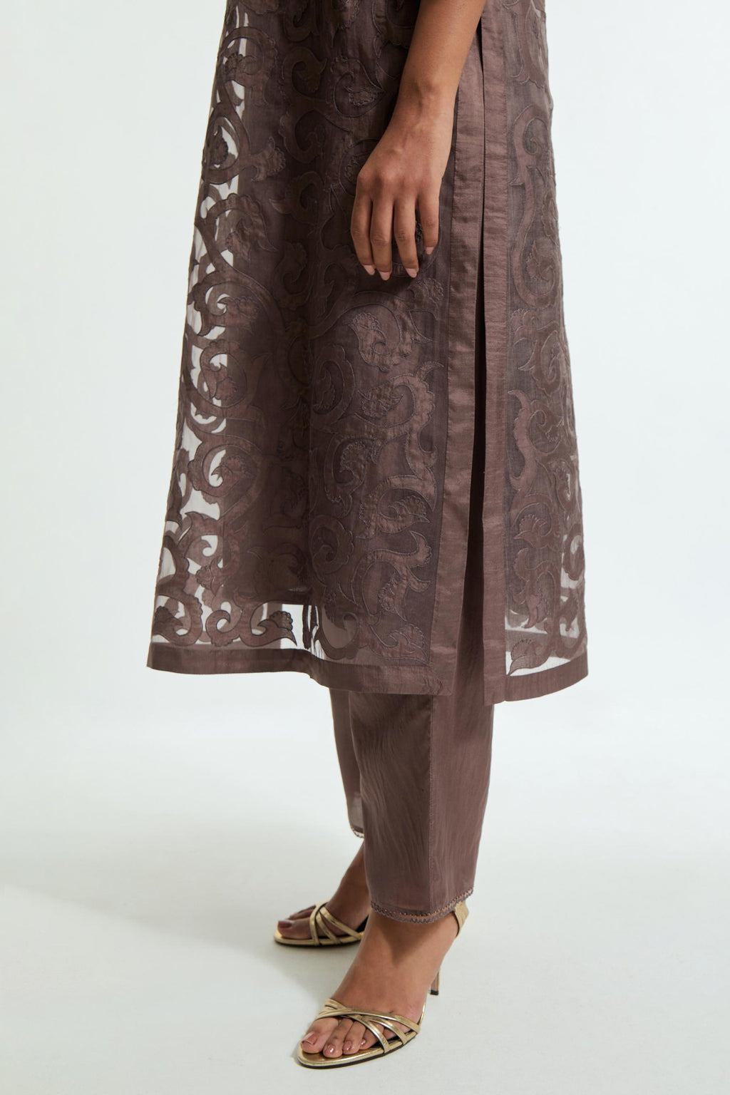 Grey silk organza straight kurta set featuring an all-over silk appliqué trellis jaal, delicately highlighted with aari threadwork.