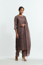 Grey silk organza straight kurta set featuring an all-over silk appliqué trellis jaal, delicately highlighted with aari threadwork.