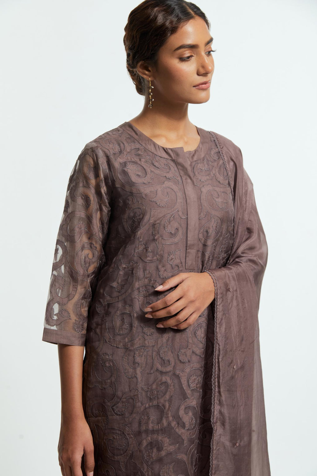 Grey silk organza straight kurta set featuring an all-over silk appliqué trellis jaal, delicately highlighted with aari threadwork.