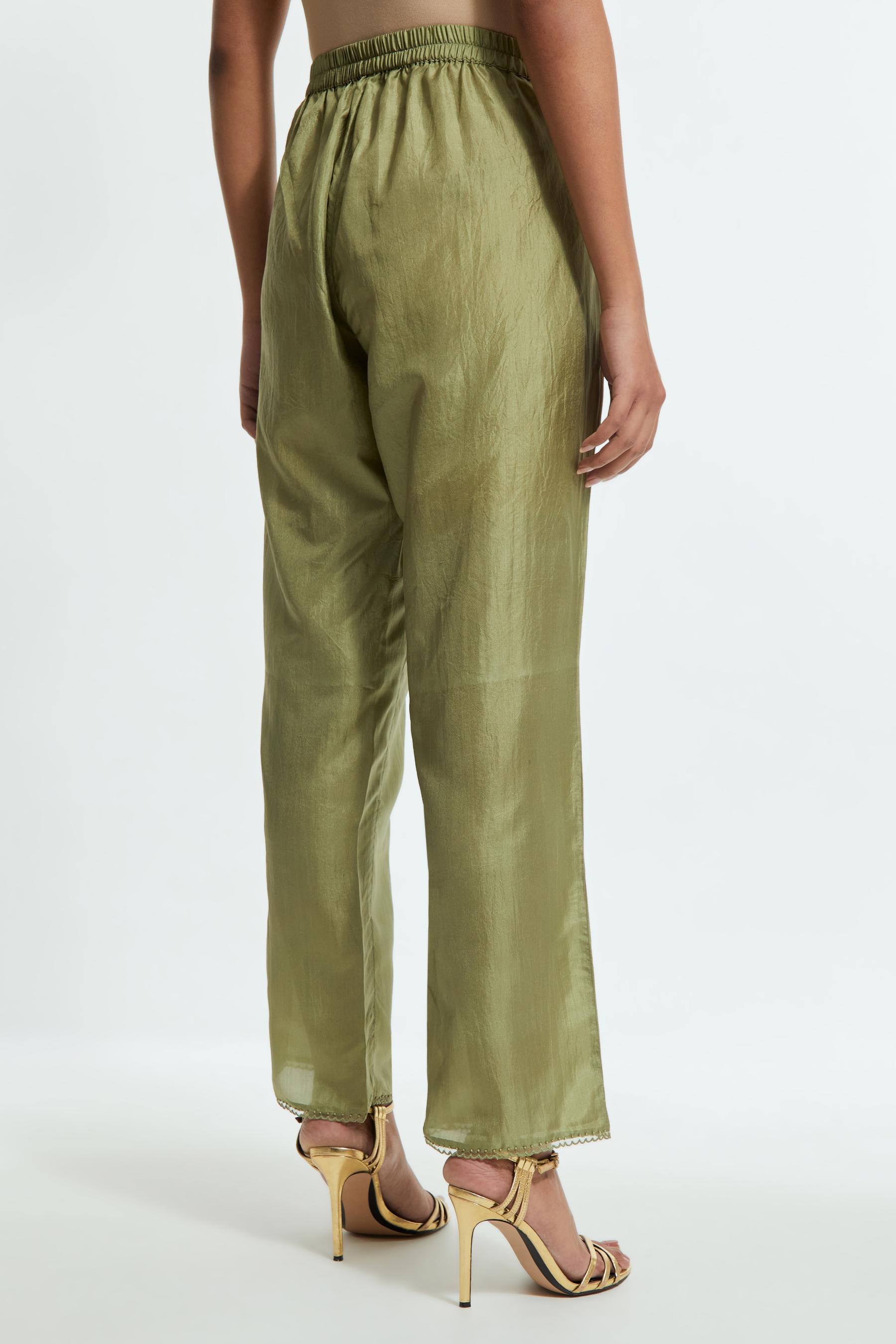 Green silk straight pants detailed with scalloped organza edging at the hem, delicately highlighted with tonal beadwork.