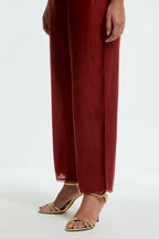 Red silk straight pants detailed with scalloped organza edging at the hem, delicately highlighted with tonal beadwork.