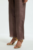 Grey silk straight pants detailed with scalloped organza edging at the hem, delicately highlighted with tonal beadwork.