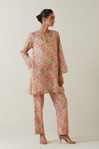 Beige tissue chanderi hand block printed easy fit short kurta, highlighted with scalloped organza at edges, paired with beige tissue chanderi all-over floral hand block printed straight pants.