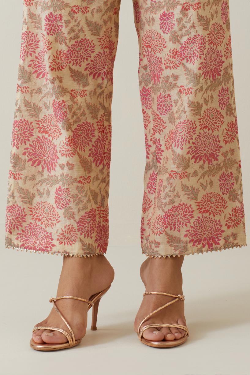 Beige tissue chanderi all-over floral hand block printed straight pants.