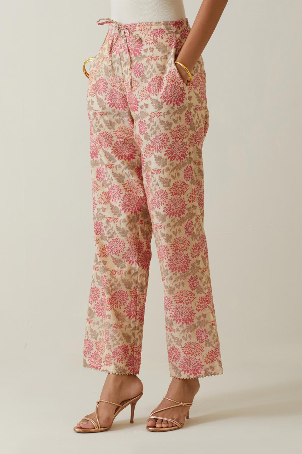 Beige tissue chanderi all-over floral hand block printed straight pants.