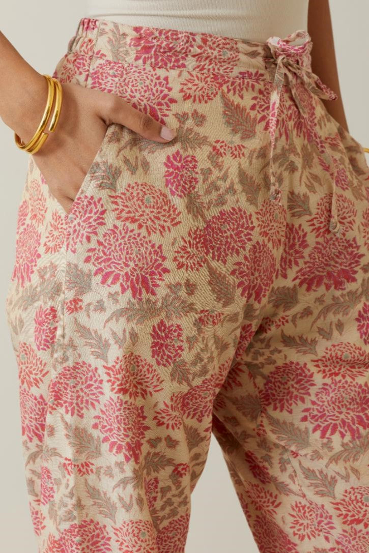 Beige tissue chanderi all-over floral hand block printed straight pants.