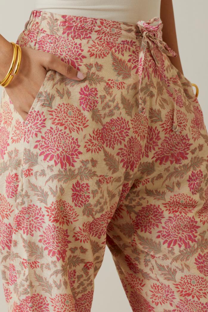 Beige tissue chanderi all-over floral hand block printed straight pants.