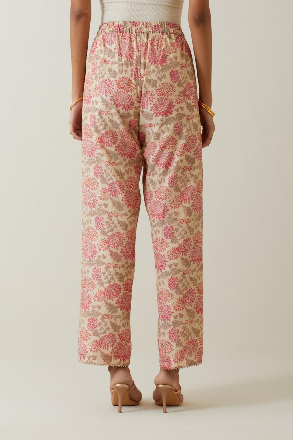 Beige tissue chanderi all-over floral hand block printed straight pants.