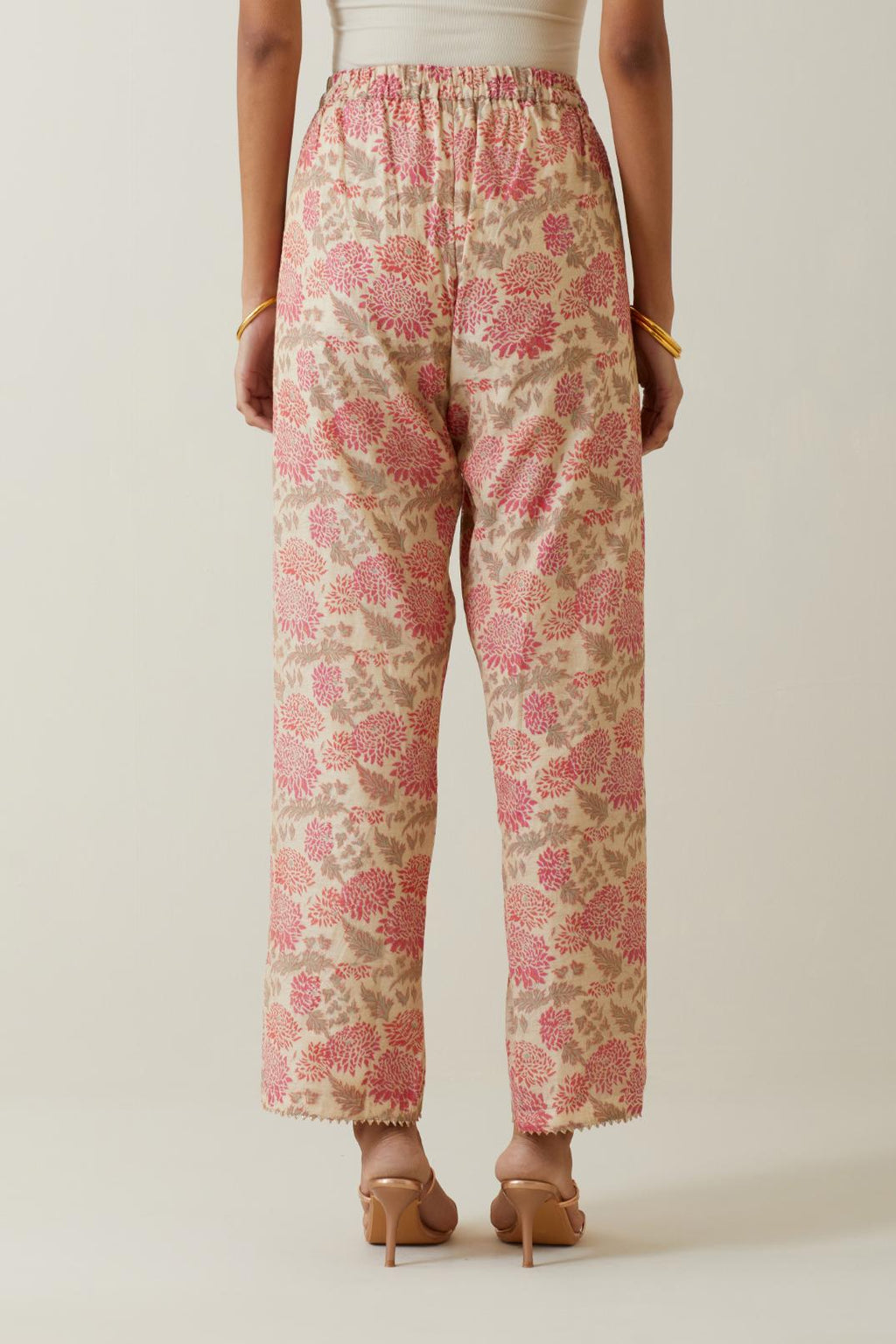 Beige tissue chanderi all-over floral hand block printed straight pants.