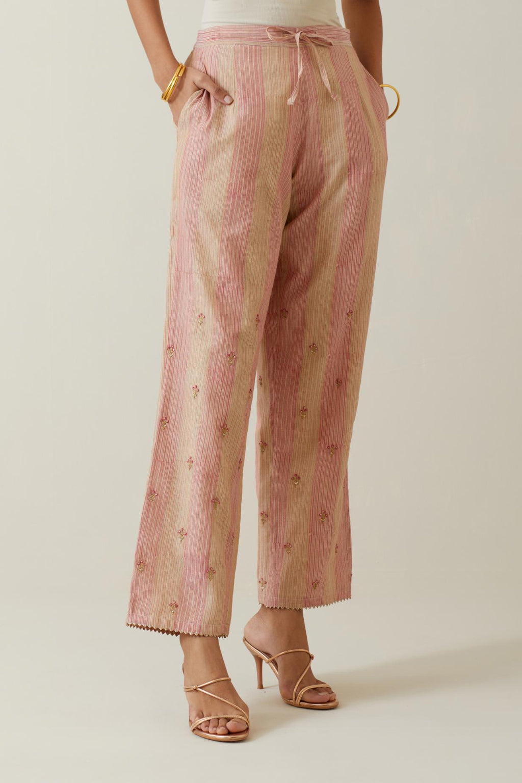 Beige tissue chanderi striped hand block printed straight pants with embroidery at bottom hem.