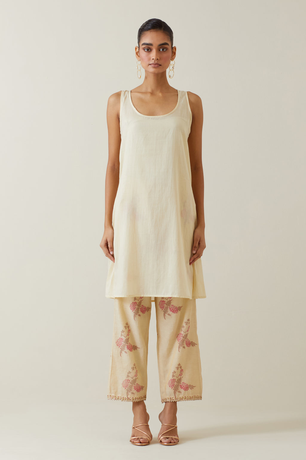 Beige tissue chanderi hand block printed A-line short kurta set.