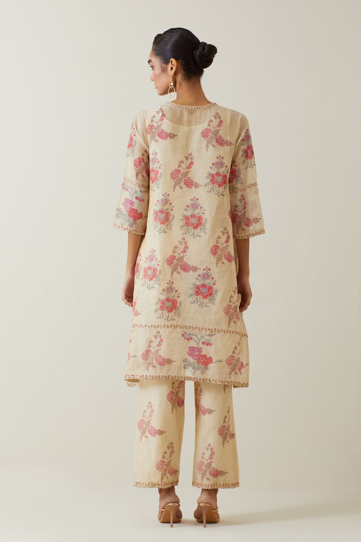 Beige tissue chanderi hand block printed A-line short kurta set.