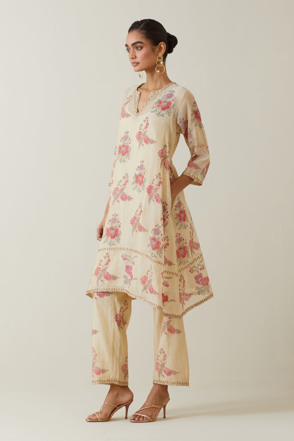 Beige tissue chanderi hand block printed A-line short kurta set.