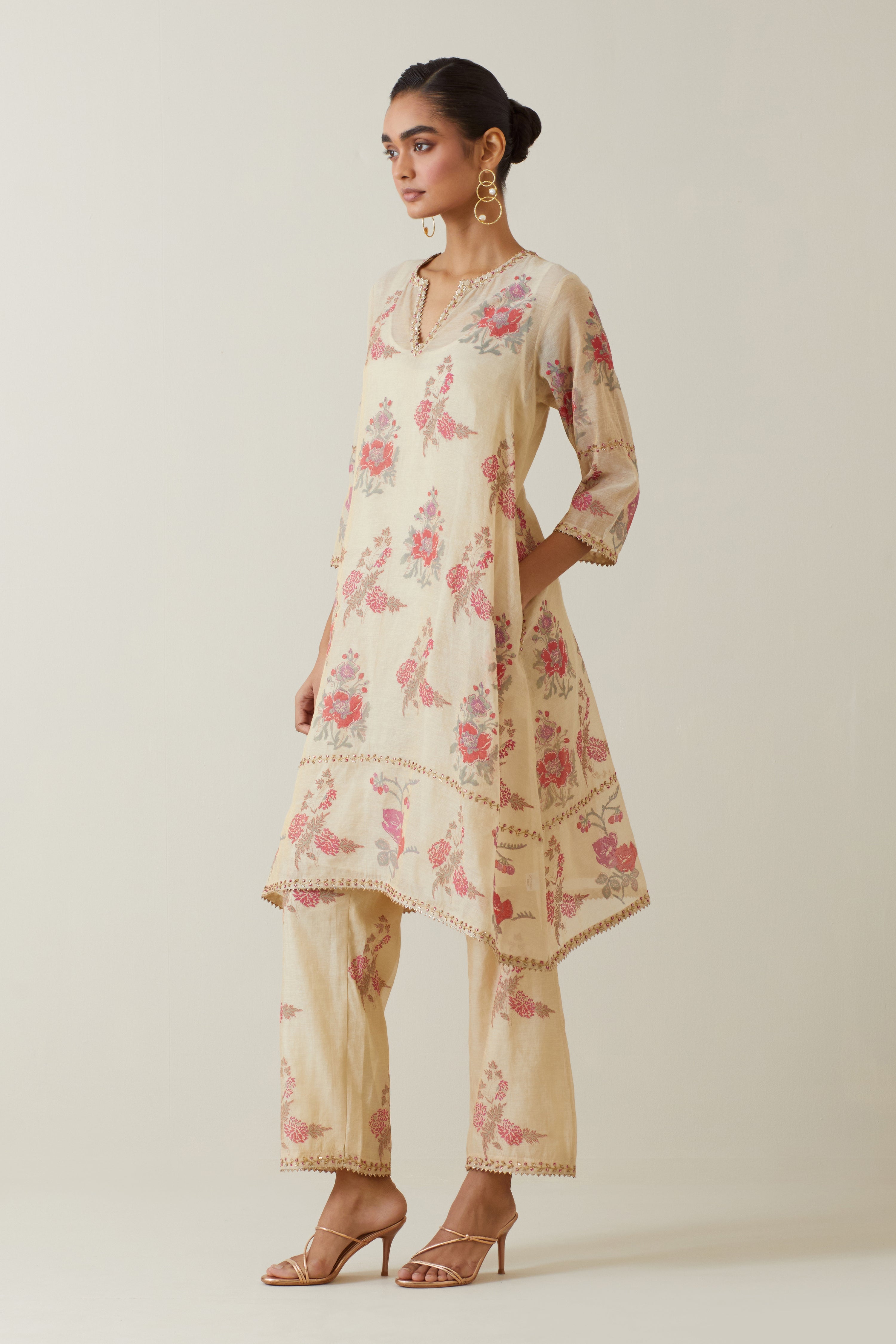Beige tissue chanderi hand block printed A-line short kurta set.
