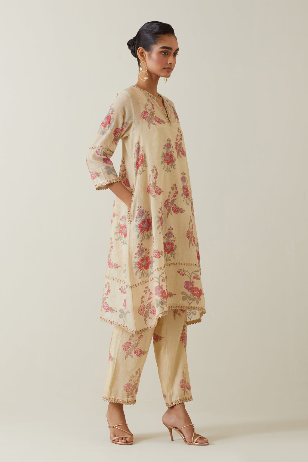 Beige tissue chanderi hand block printed A-line short kurta set.