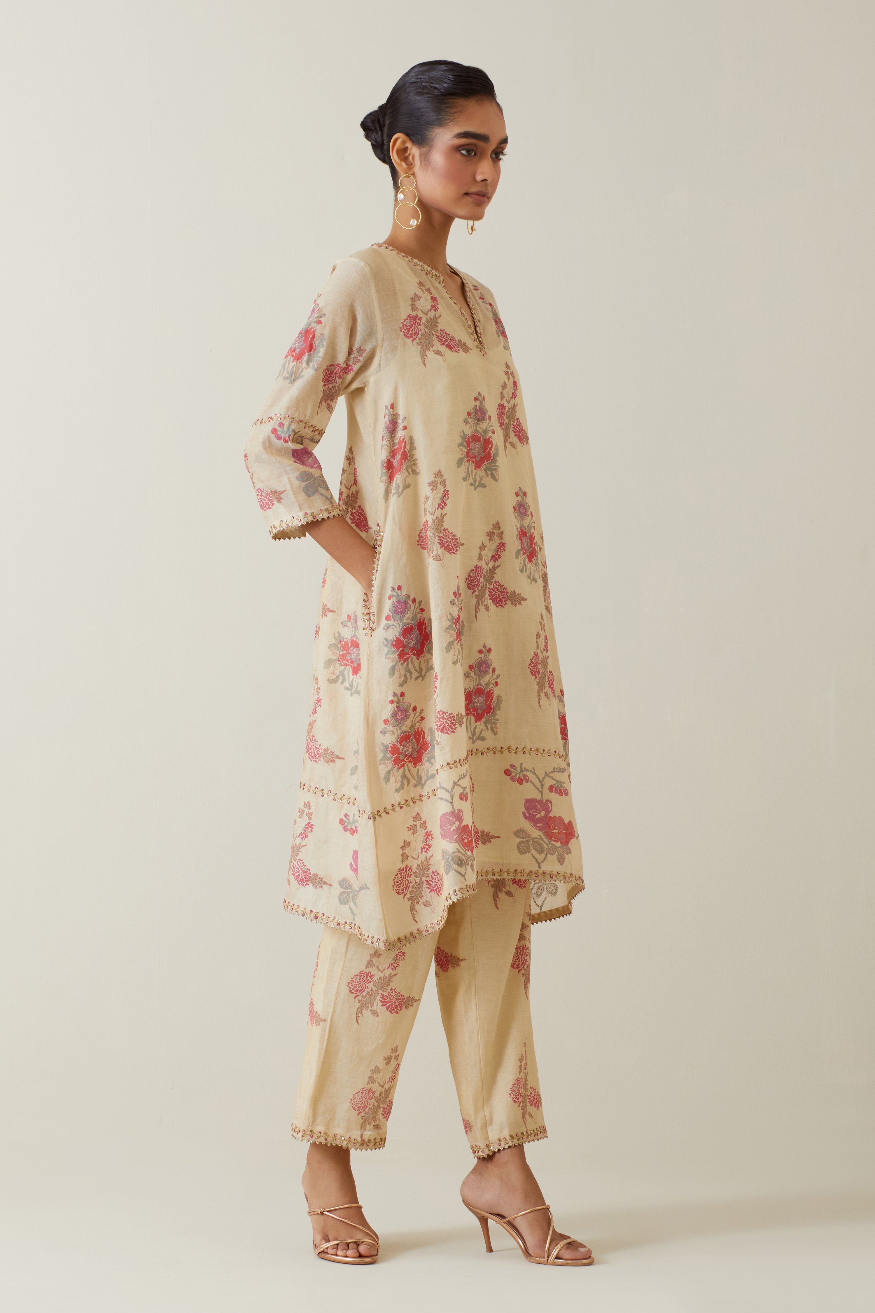 Beige tissue chanderi hand block printed A-line short kurta set.