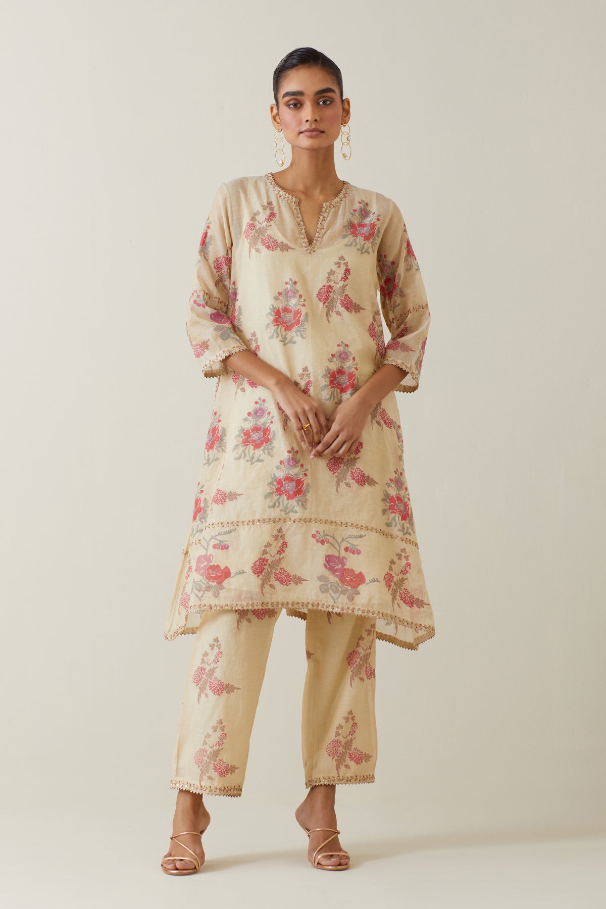 Beige tissue chanderi hand block printed A-line short kurta set.