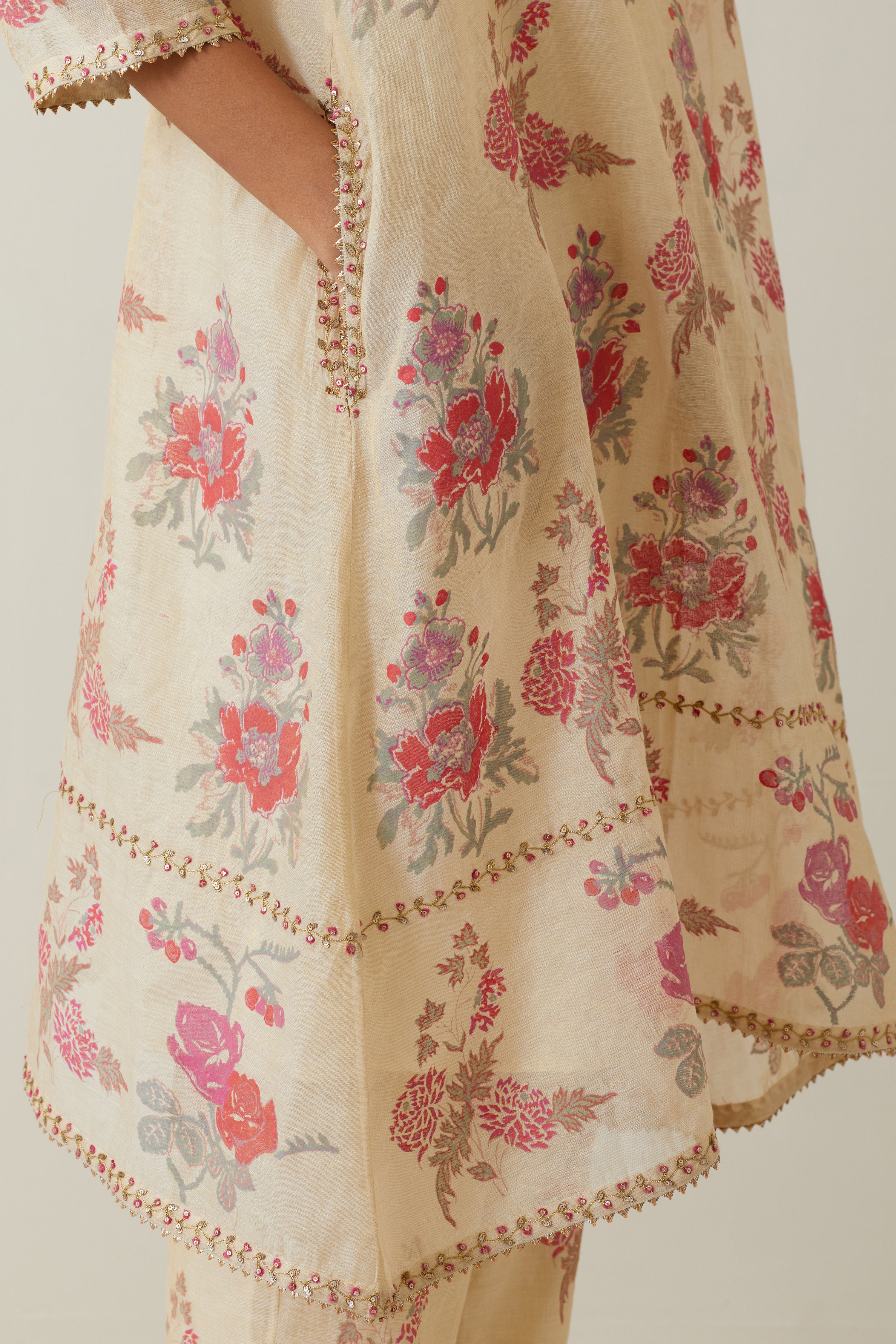 Beige tissue chanderi hand block printed A-line short kurta set.