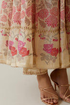 Beige tissue chanderi hand block printed multi-paneled kurta dress set with 3/4 sleeves, highlighted with sequins, thread and zari work.