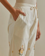 Yellow and off-white straight pants with all over multi color embroidery detailed with sequins.