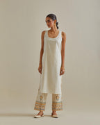 Yellow and off-white cotton chanderi straight kurta set with all over patchwork, silk thread, mirror, tassels and sequins embroidery.