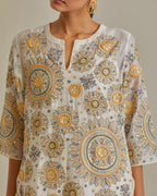 Yellow and off-white cotton chanderi straight kurta set with all over patchwork, silk thread, mirror, tassels and sequins embroidery.