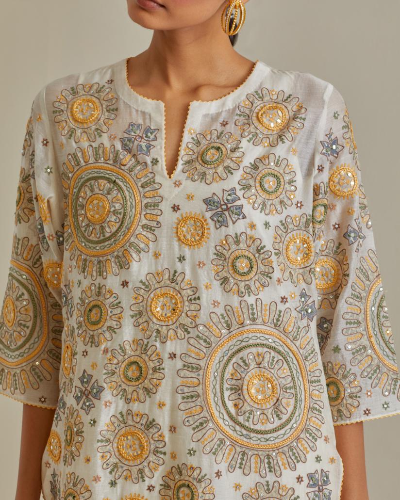 Yellow and off-white cotton chanderi straight kurta set with all over patchwork, silk thread, mirror, tassels and sequins embroidery.