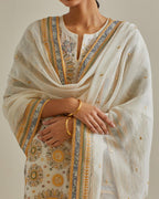 Yellow and off-white cotton chanderi straight kurta set with all over patchwork, silk thread, mirror, tassels and sequins embroidery.