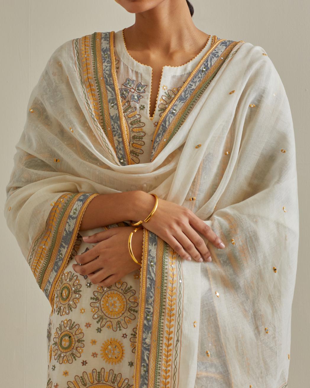Yellow and off-white cotton chanderi straight kurta set with all over patchwork, silk thread, mirror, tassels and sequins embroidery.