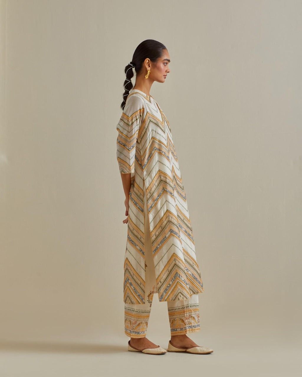 Yellow and off-white cotton chanderi straight kurta set with all over chevron pattern. It is embellished with silk patchwork, thread, sequins and mirrors.