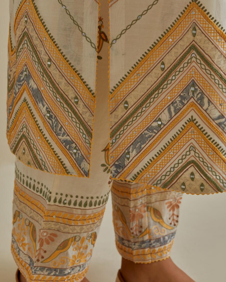 Yellow and off-white cotton chanderi straight kurta set with all over chevron pattern. It is embellished with silk patchwork, thread, sequins and mirrors.
