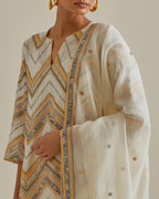 Yellow and off-white cotton chanderi straight kurta set with all over chevron pattern. It is embellished with silk patchwork, thread, sequins and mirrors.