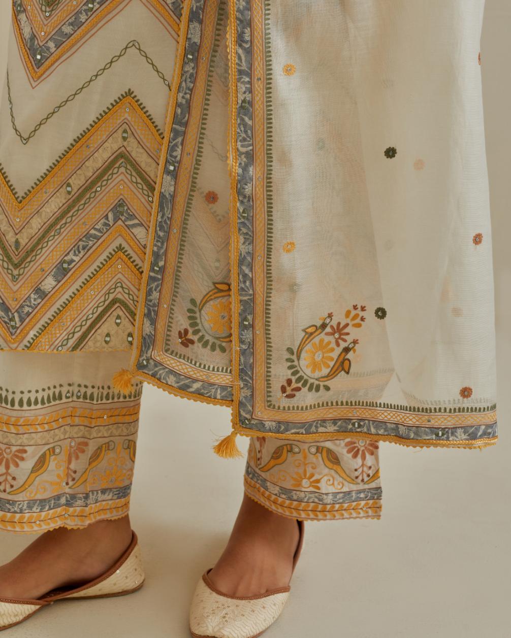 Yellow and off-white cotton chanderi straight kurta set with all over chevron pattern. It is embellished with silk patchwork, thread, sequins and mirrors.