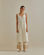 Yellow and off-white cotton chanderi embroidered kurta dress set with V neck, yoke and fine gathers at empire line.