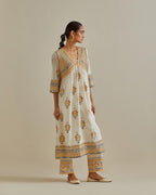 Yellow and off-white cotton chanderi embroidered kurta dress set with V neck, yoke and fine gathers at empire line.
