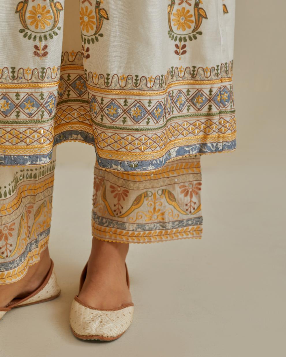 Yellow and off-white cotton chanderi embroidered kurta dress set with V neck, yoke and fine gathers at empire line.