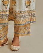 Yellow and off-white cotton chanderi embroidered kurta dress set with V neck, yoke and fine gathers at empire line.