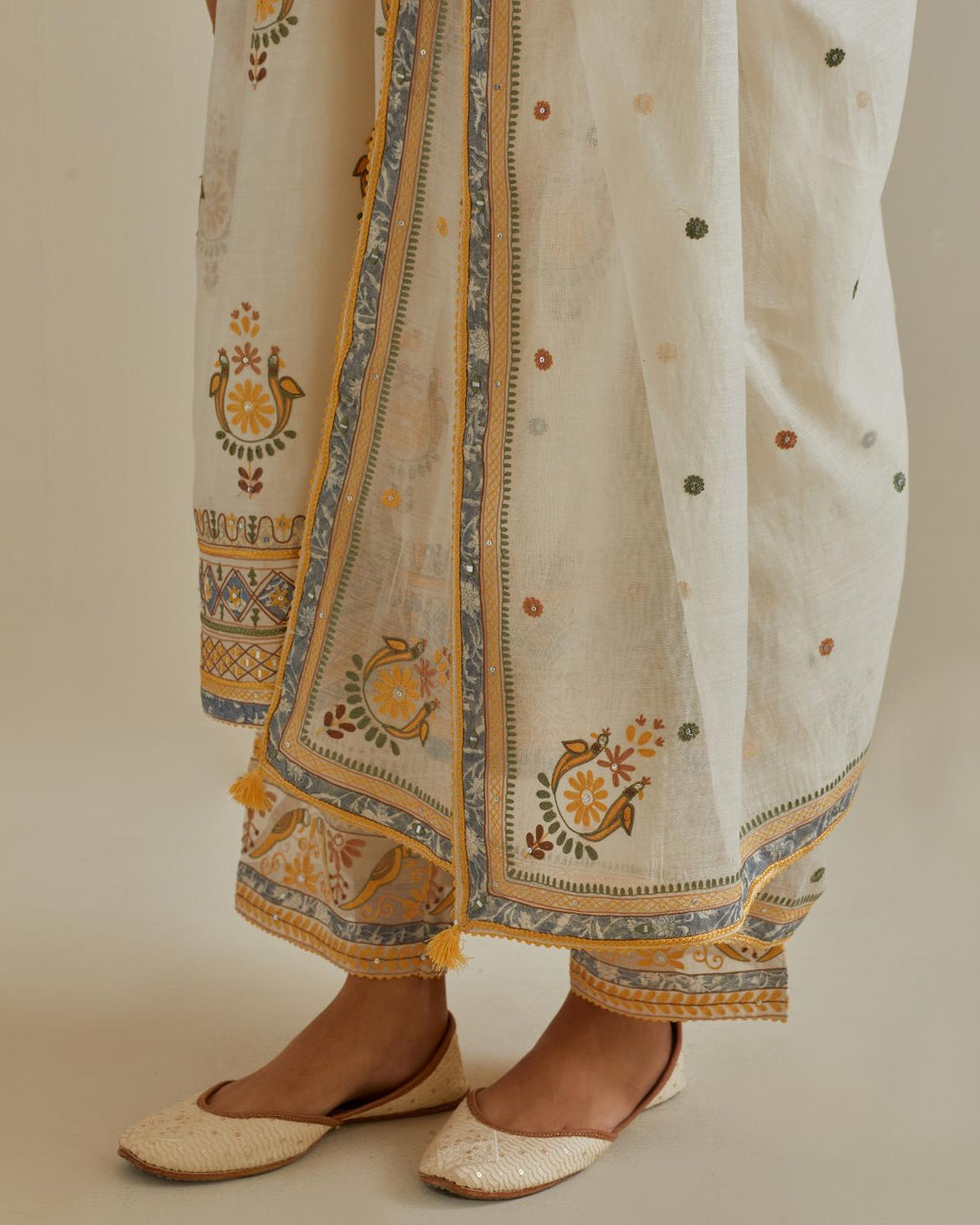 Yellow and off-white cotton chanderi embroidered kurta dress set with V neck, yoke and fine gathers at empire line.