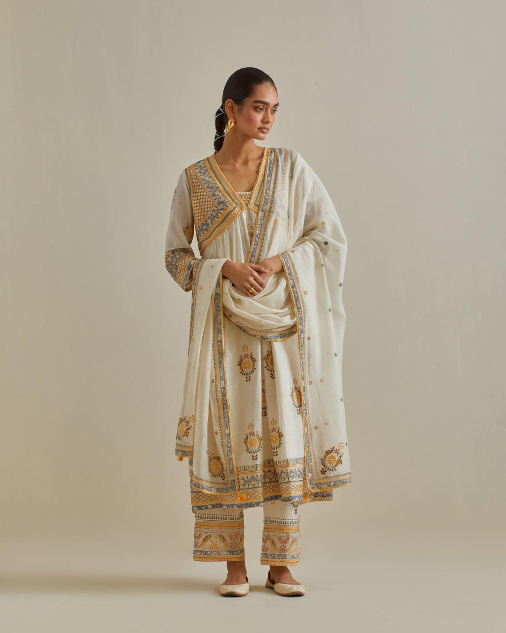 Yellow and off-white cotton chanderi embroidered kurta dress set with V neck, yoke and fine gathers at empire line.