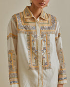 Yellow and off-white cotton chanderi embroidered shirt with full sleeves, paired with off white cotton straight pants with all over multi color embroidery detailed with sequins.