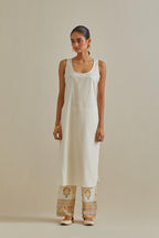 Yellow and off-white cotton chanderi easy fit long kaftan detailed with patch, silk thread, mirror & sequins work, paired with off white cotton straight pants with all over multi color embroidery detailed with sequins.