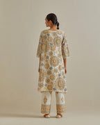 Yellow and off-white A-line cotton chanderi kurta set with all over patchwork, silk thread, mirror, tassels and sequin embroidery.