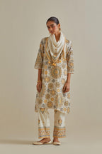Yellow and off-white A-line cotton chanderi kurta set with all over patchwork, silk thread, mirror, tassels and sequin embroidery.