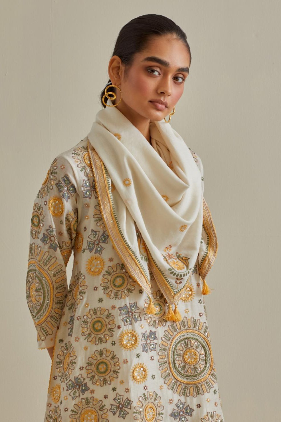 Yellow & off-white cotton square scarf with delicate silk thread embroidery, highlighted with braids, mirrors and sequins work.