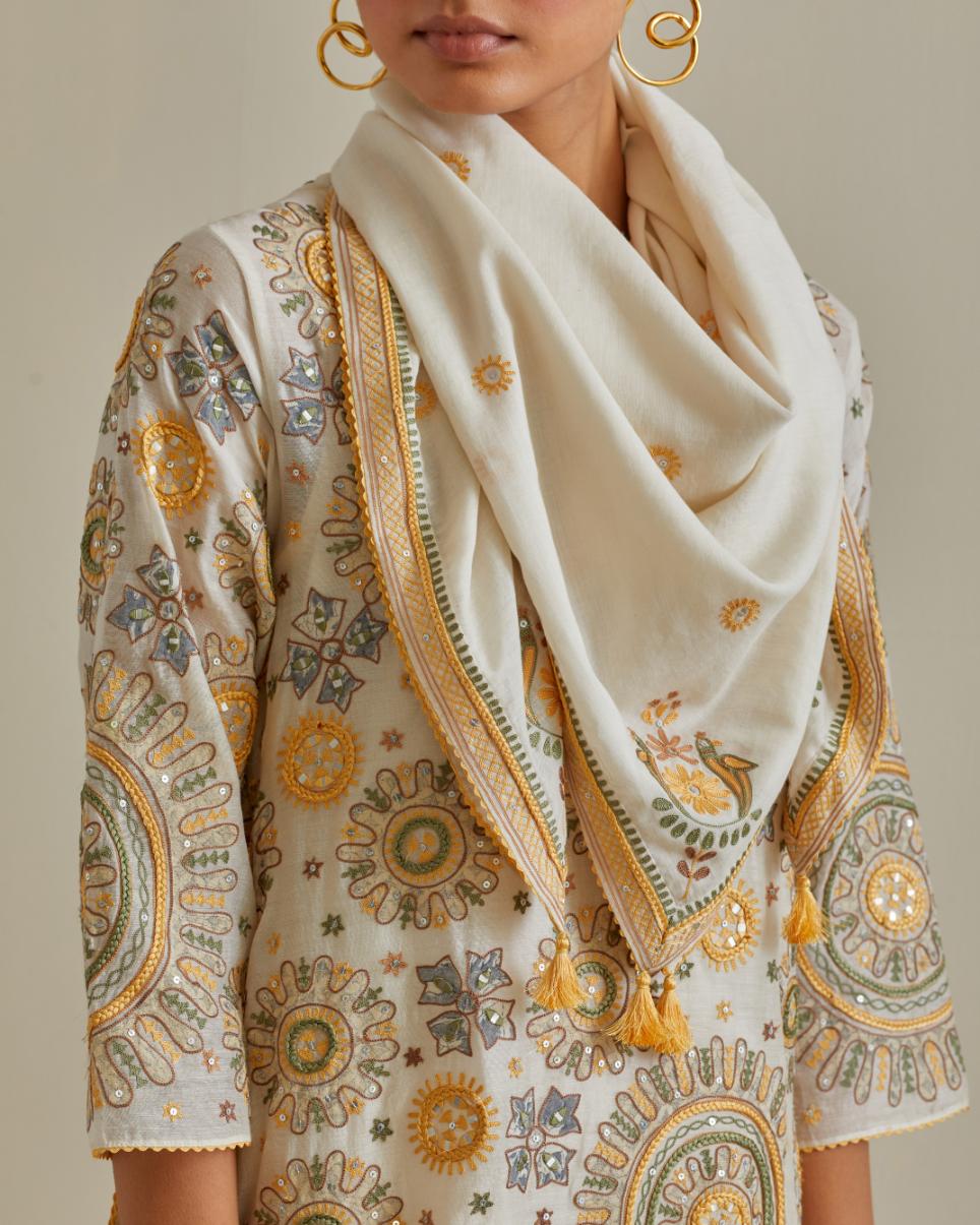 Yellow and off-white A-line cotton chanderi kurta set with all over patchwork, silk thread, mirror, tassels and sequin embroidery.