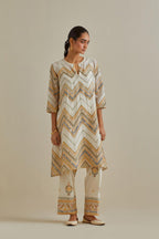 Yellow and off-white cotton chanderi A-line kurta set with all over embroidery set in bold chevron stripes.