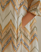 Yellow and off-white cotton chanderi A-line kurta set with all over embroidery set in bold chevron stripes.