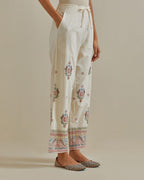 Pink and off-white straight pants with all over multi color embroidery detailed with sequins.